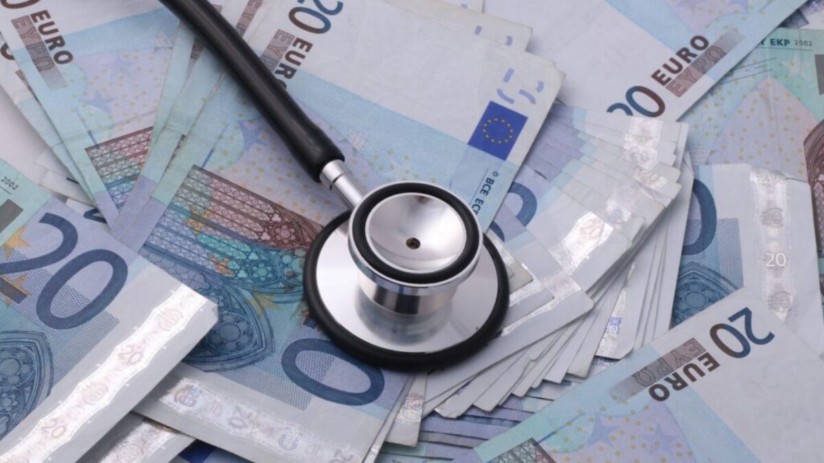 silver and black stethoscope on 100 indian rupee bill