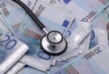 silver and black stethoscope on 100 indian rupee bill