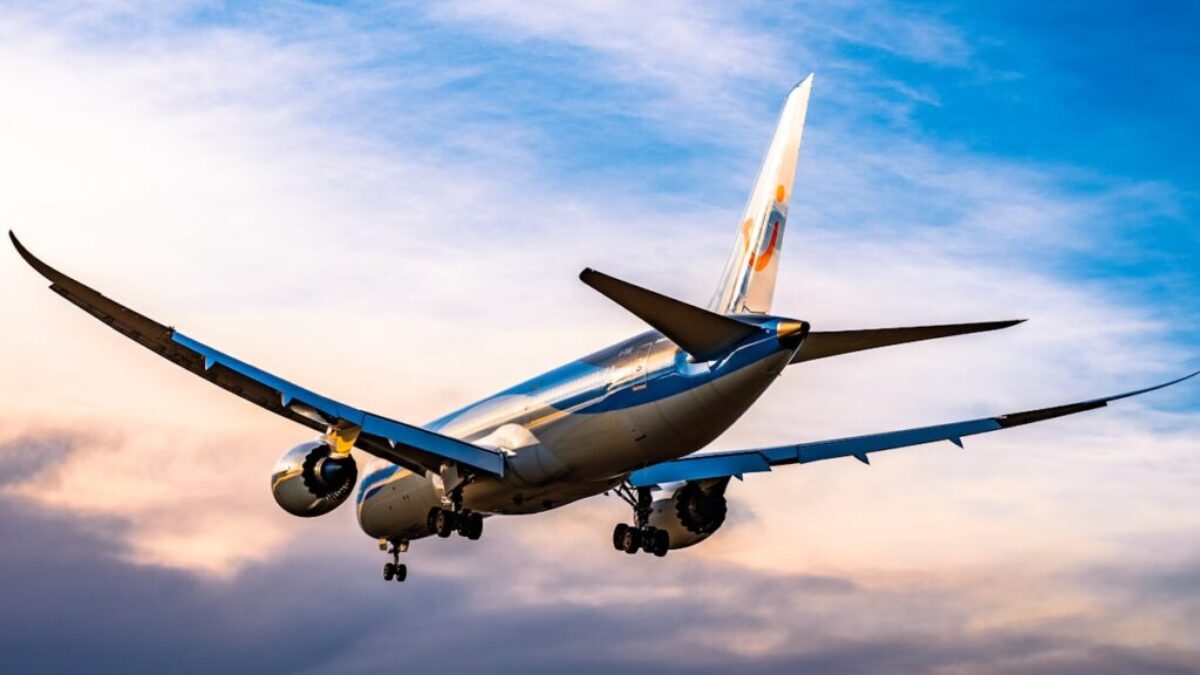 blue and white airplane flying during daytime
