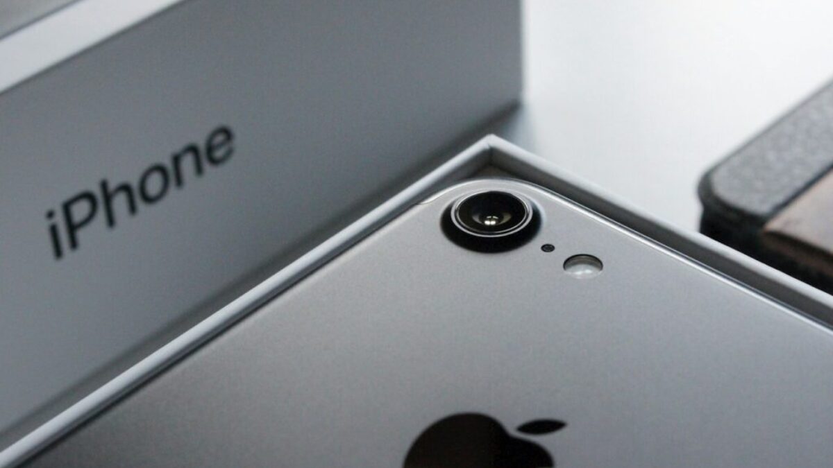 a close up of two cell phones near one another