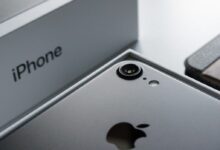 a close up of two cell phones near one another