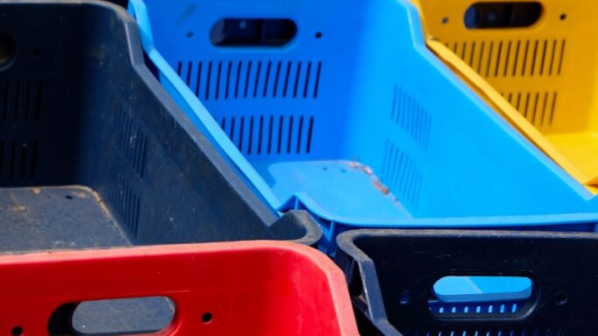 a row of plastic bins sitting next to each other