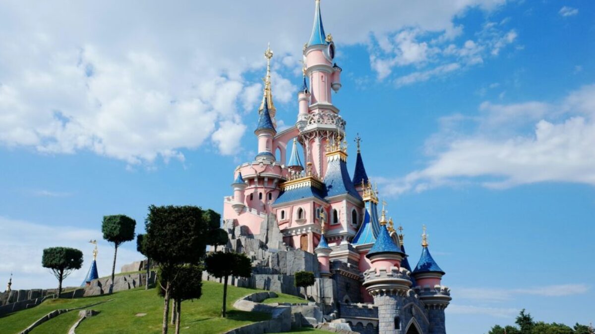 white and blue castle under white clouds and blue sky during daytime