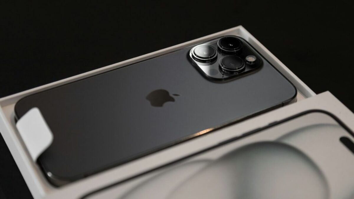 an iphone in a box on a black background
