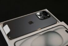 an iphone in a box on a black background