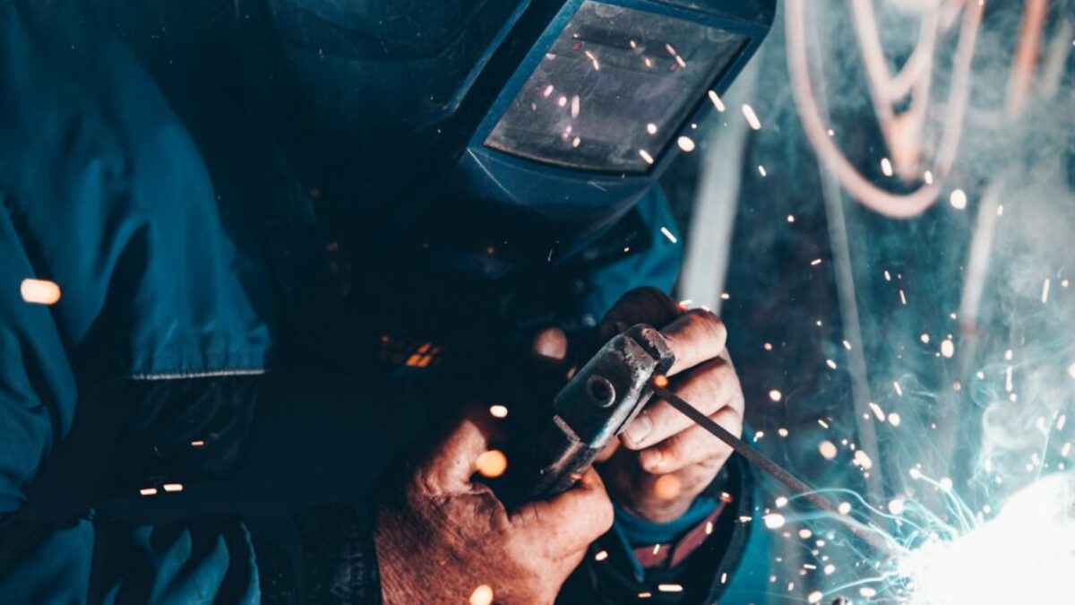 man using welding machine