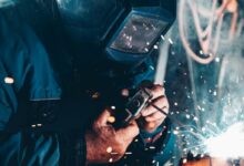 man using welding machine