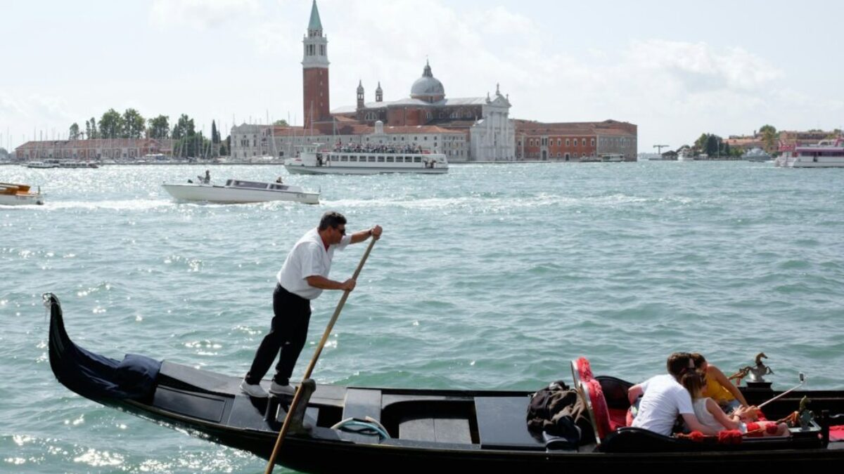 people riding on boat on river during daytime