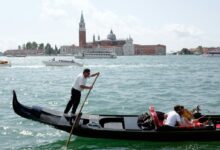 people riding on boat on river during daytime