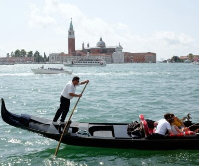 people riding on boat on river during daytime