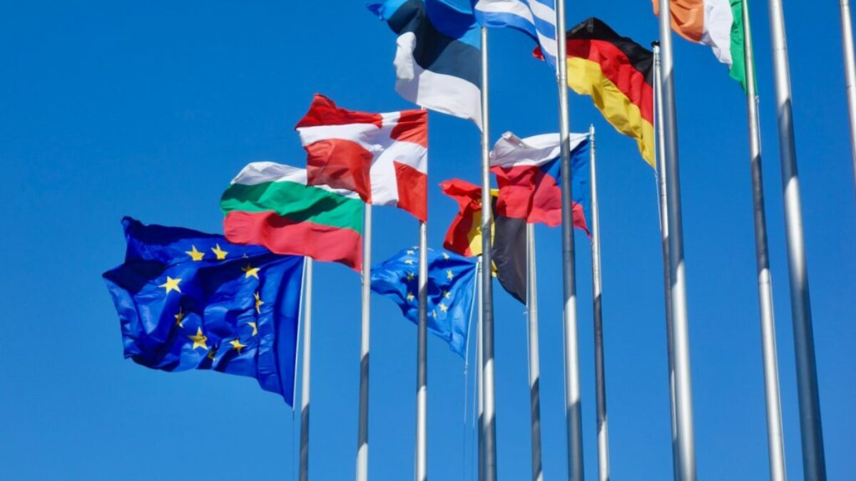 a bunch of flags that are flying in the air