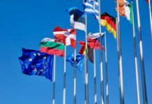 a bunch of flags that are flying in the air