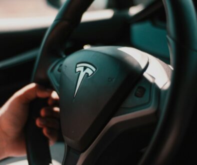 person holding black honda steering wheel