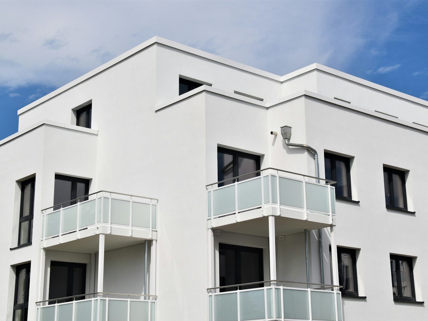 white concrete building under blue sky during daytime