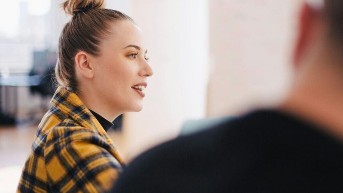 woman wearing yellow and black plaid shirt