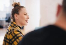 woman wearing yellow and black plaid shirt