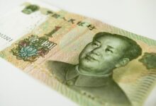 a close up of a bank note with a man's face on it