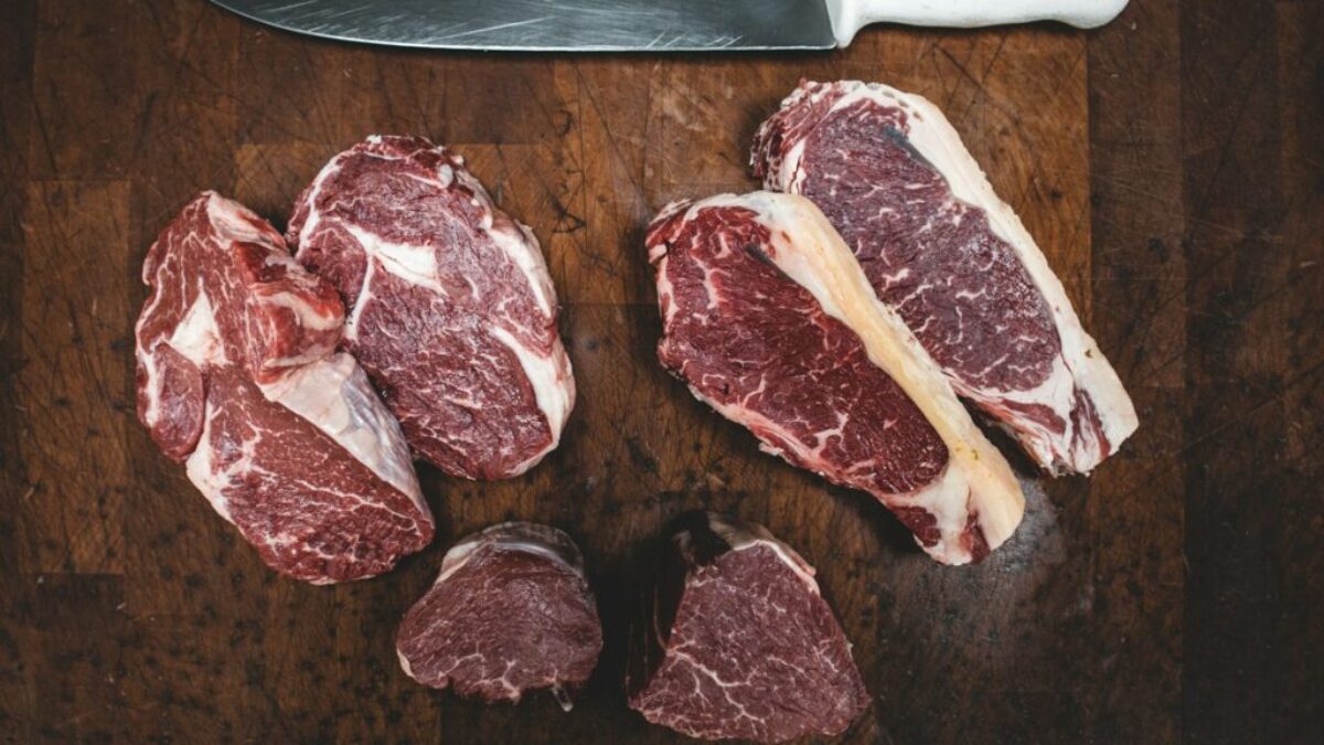 sliced meat beside silver knife