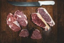 sliced meat beside silver knife