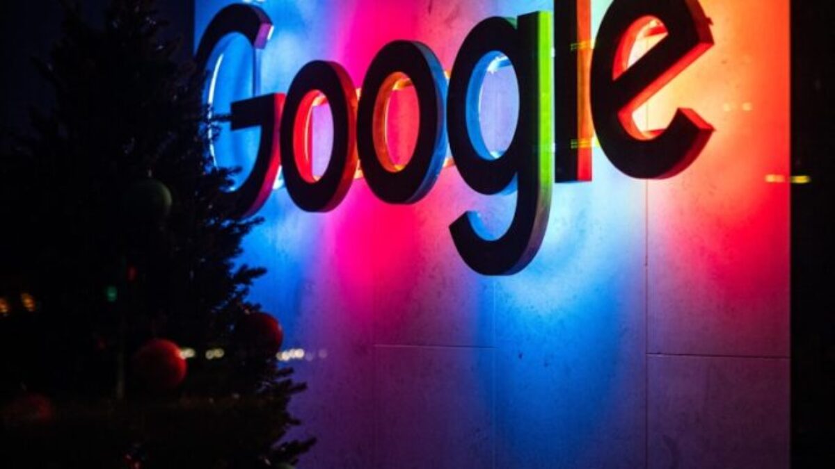 the google logo is lit up at night