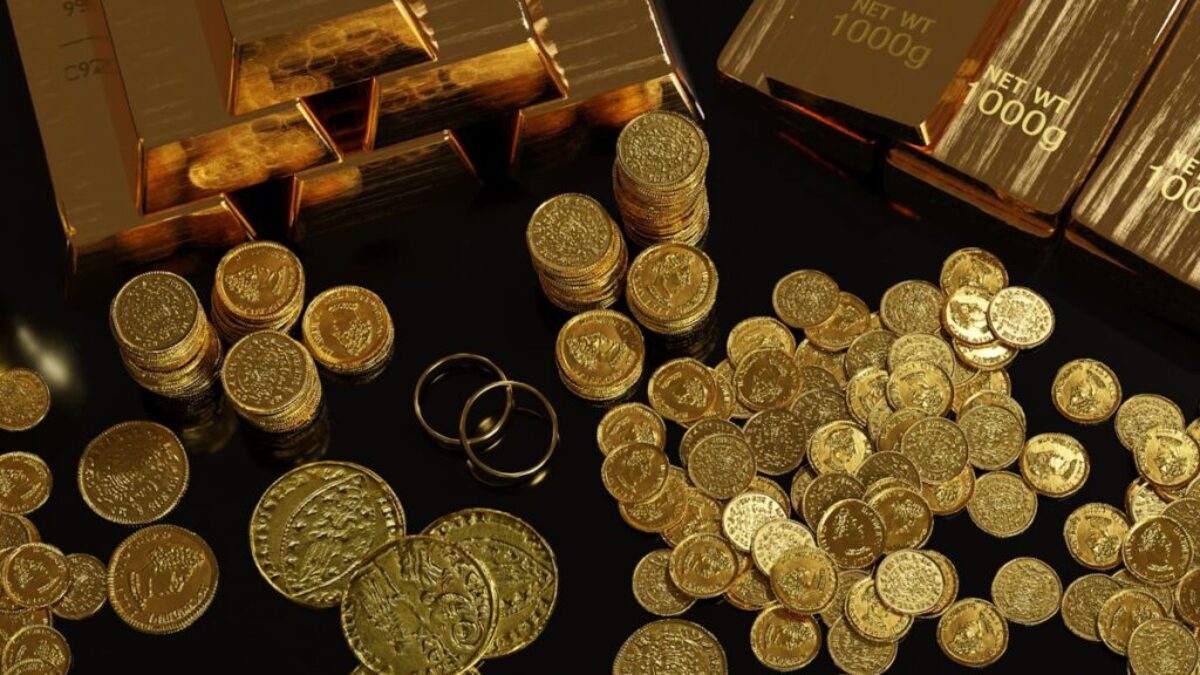a table topped with lots of gold coins