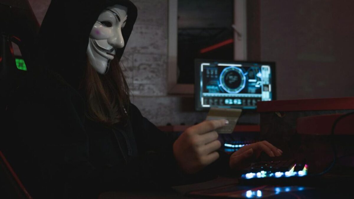 Woman in Black Hoodie Holding a Bank Card