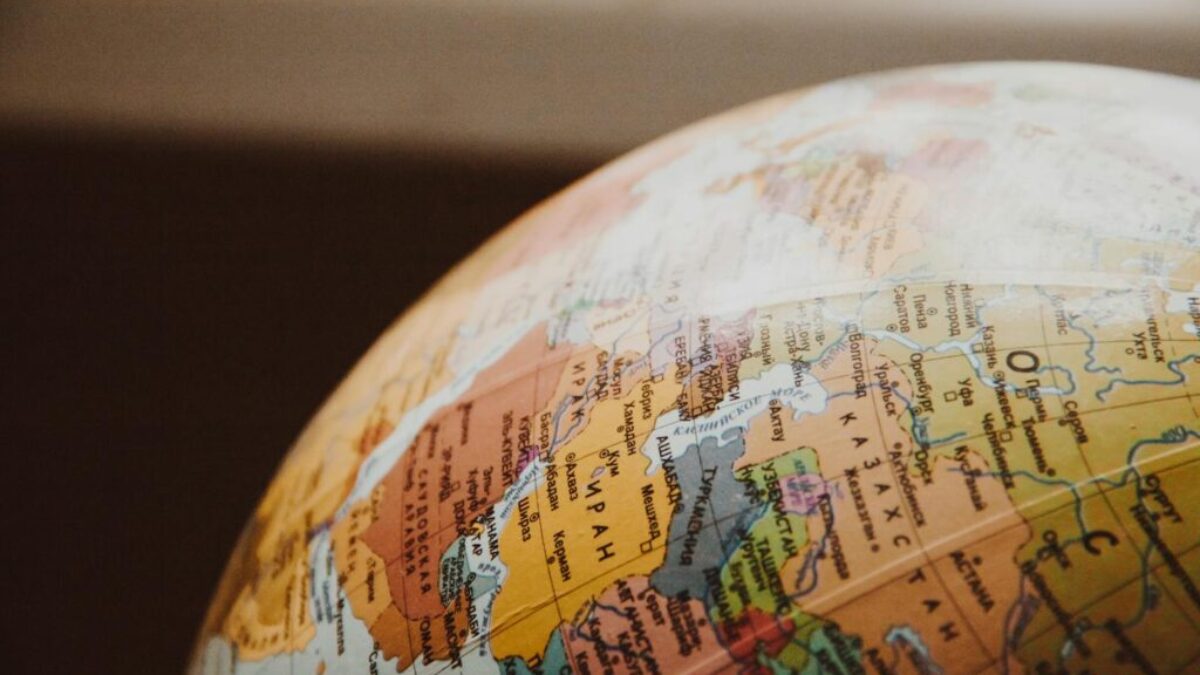 Detailed close-up of a globe showcasing parts of Europe and Asia for world exploration concepts.