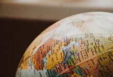 Detailed close-up of a globe showcasing parts of Europe and Asia for world exploration concepts.