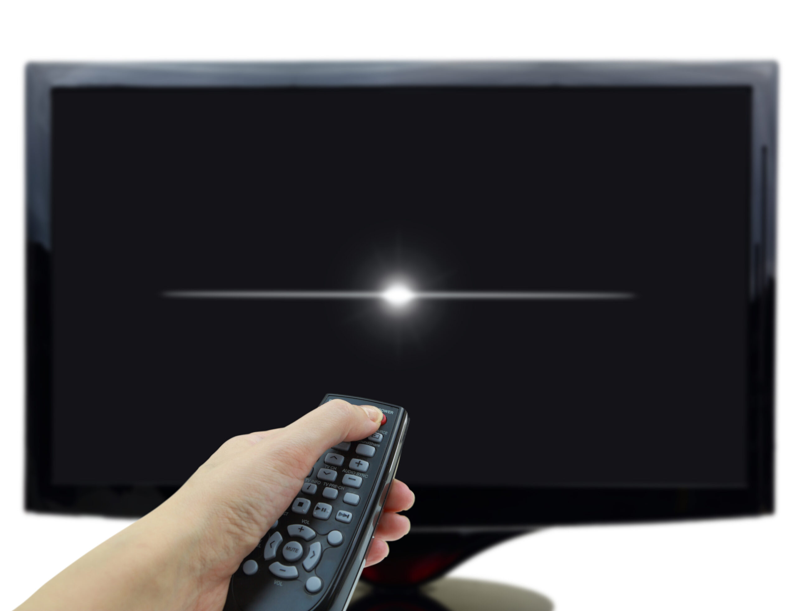 Ruka mířící ovladačem na TV a vypínající ji